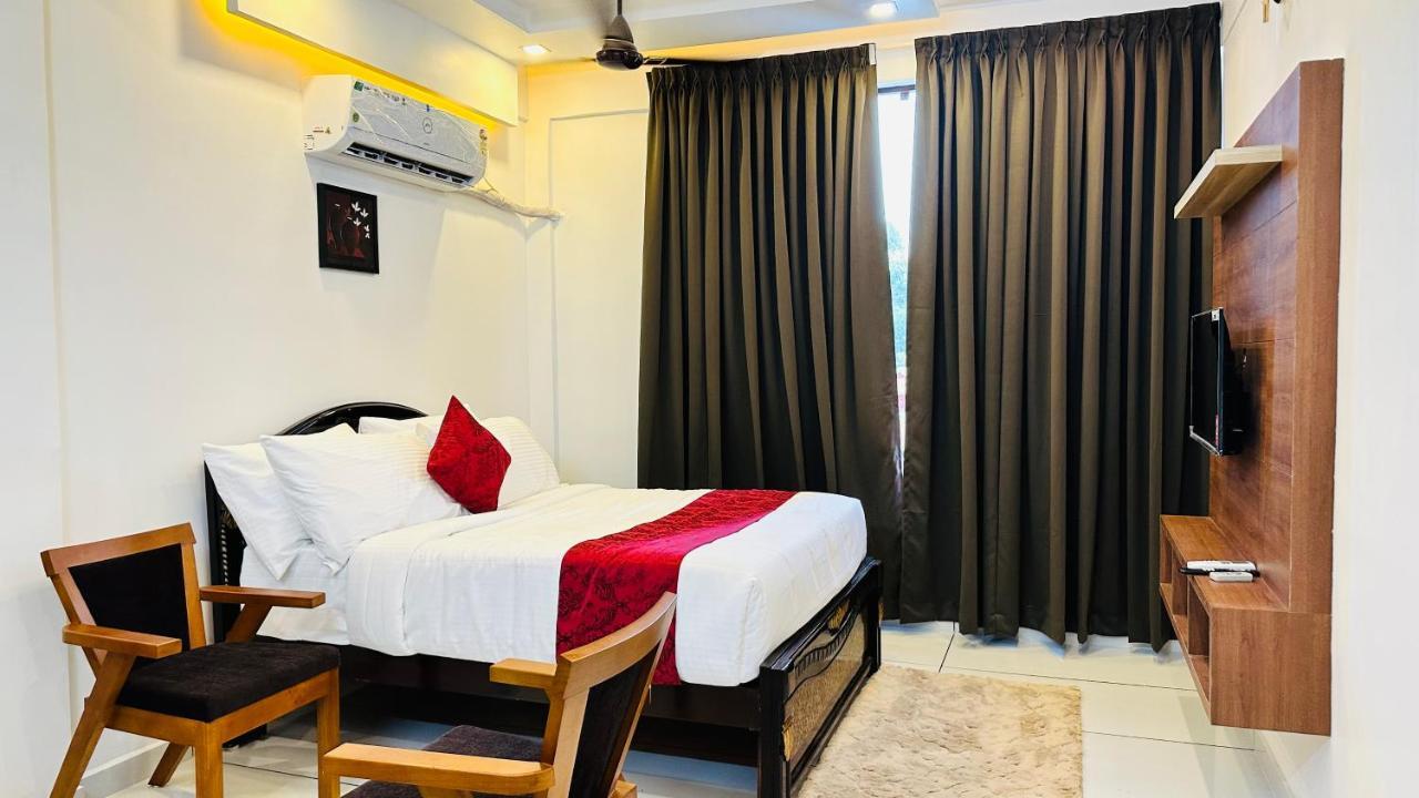 Achoos Residency Hotel Tiruvalla Kültér fotó