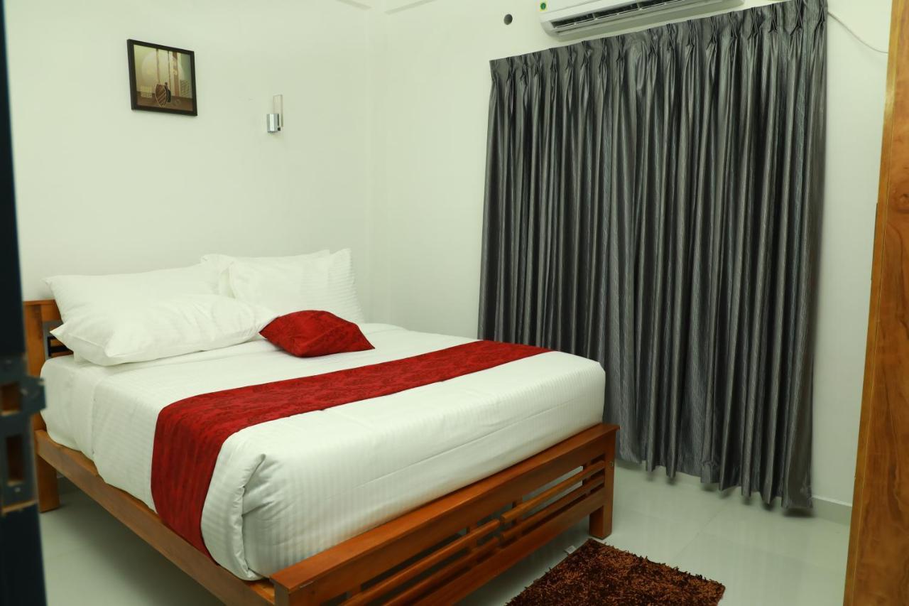 Achoos Residency Hotel Tiruvalla Kültér fotó