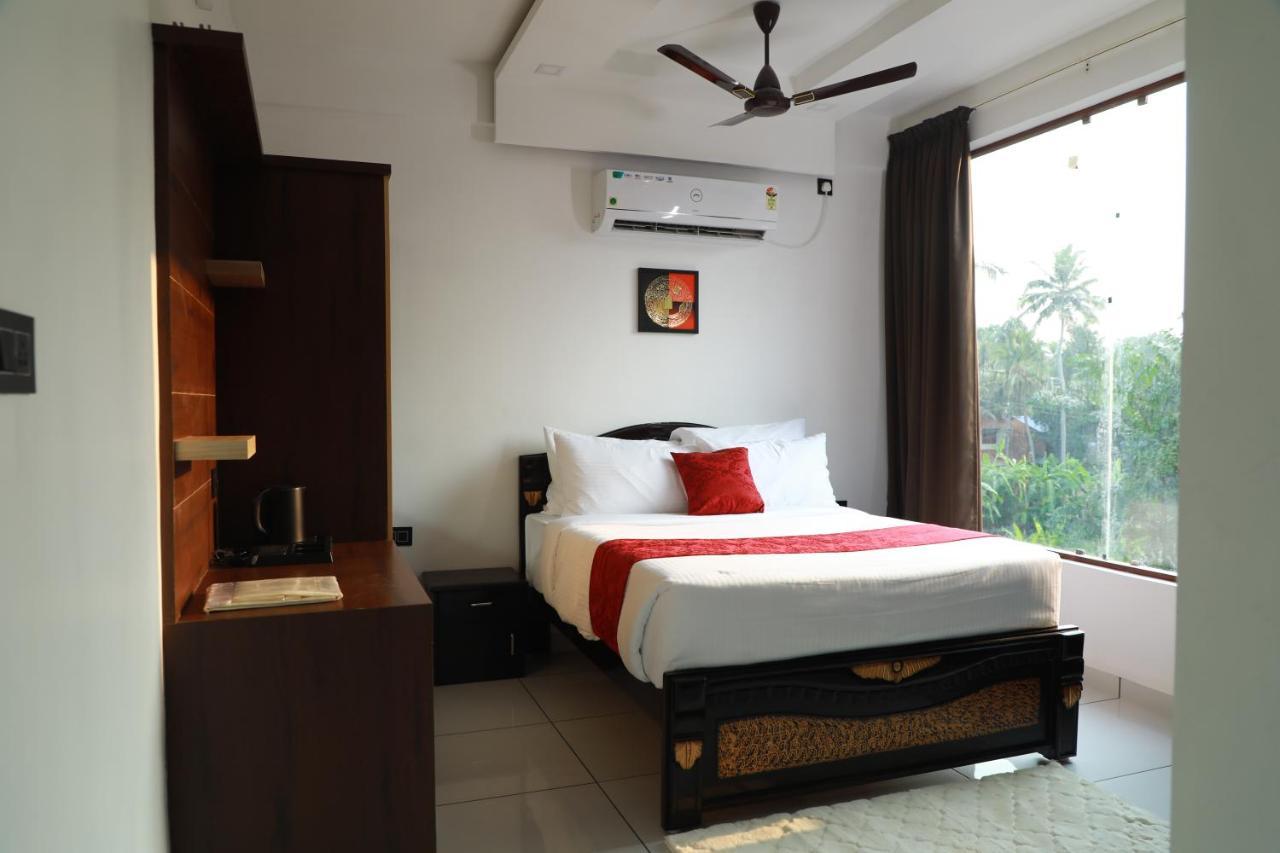 Achoos Residency Hotel Tiruvalla Kültér fotó